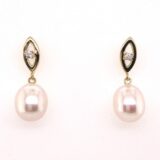oorrslingers parels geelgoud 18ct zirconium