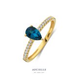 AR0173C  ring geelgoud zirconium met topaas london blue